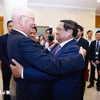 Prime Minister Pham Minh Chinh (R) and Founder and Executive Chairman of the World Economic Forum (WEF) Prof. Klaus Schwab at their meeting on October 7. (Photo: VNA)