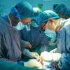 Doctors perform the heart-liver transplant on the patient (Photo: VietnamPlus)