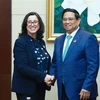 Prime Minister Pham Minh Chinh (R) and WB Vice President for East Asia and Pacific Manuela Ferro. (Photo: VNA)