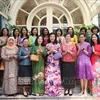 The spouse of Party General Secretary and State President To Lam, Ngo Phuong Ly (front row, 4th from right), and her guests at the meeting in Hanoi on October 11. (Photo: VNA)