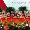 Delegates vote to approve the list of 374 members of the 9th Central Committee of the Vietnam Fatherland Front in the 2019-2024 tenure. (Photo: VNA)