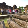 Foreign tourists visit My Son Sanctuary in the central province of Quang Nam. (Photo: VNA)