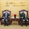 Minister of National Defence General Phan Van Giang (right) and Chinese Ambassador to Vietnam He Wei (Photo: VNA)