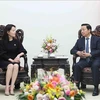 Deputy Prime Minister Tran Hong Ha (R) receives General Director of Pacific Construction Group of China Wo Jing. (Photo: VNA)