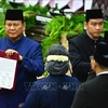 Prabowo Subianto (left) takes over as new president of Indonesia on October 20. (Photo: XINHUA/VNA)