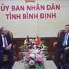 Secretary of the Binh Dinh provincial Party Committee Ho Quoc Dung (R) and Per Hornung Pedersen, Chairman and CEO of German company PNE at the meeting on October 22 (Photo: VNA)