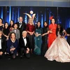 Deputy Ambassador of Vietnam to the UK To Minh Thu (in blue Ao Dai) takes a photo with the award winners. (Photo: VNA)