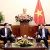 Deputy Prime Minister and Minister of Foreign Affairs Bui Thanh Son (R) receives Chinese Ambassador to Vietnam He Wei in Hanoi on October 22. (Photo: VNA)