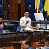 Malaysian Prime Minister Anwar Ibrahim unveiling the 2025 national budget at the Malaysian Parliament in Kuala Lumpur on Oct 18. (Photo: AFP)