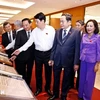 State President Luong Cuong, National Assembly (NA) Chairman Tran Thanh Man and NA deputies visit the exhibition (Photo: VNA)