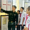 The digital exhibition entitled “Vietnam’s Hoang Sa (Paracel) and Truong Sa (Spratly): Historical and legal evidence” is held in Hai Xuan high school. (Photo: VNA)