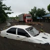 Flooding caused by tropical storm Trami in the Philippines on October 23. (Photo: Reuters/VNA)