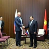 Prime Minister Pham Minh Chinh (R) receives General Director of Russsia's Zarubezhneft JSC Kudryashov Sergei Ivanovich in Kazan on October 23. (Photo: VNA) 