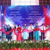 Representatives from Vietnamese and Lao agencies, localities and businesses at the opening ceremony of the Vietnam-Laos trade fair 2024 in Xiengkhouang province. (Photo: VNA)