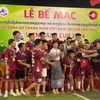 Young Vietnamese football players at the closing ceremony of the 10th Vietnam Youth Football Tournament in Laos. (Photo: VNA)