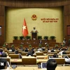 Participants at the seventh working day of 15th NA’s eighth session. (Photo: VNA)