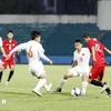 Vietnam (white) secure a 1-1 draw against Yemen in the last match of Group I. (Photo: VNA)