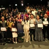 Vietnamese director and producer Mai Thu Huyen (7th from right) and participants at the UK premiere of “Doa hoa mong manh” (a fragile flower) in London. (Photo: VNA)