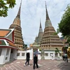 Tourists visit the Wat Pho temple in Bangkok, Thailand. (Photo: Xinhua/VNA)