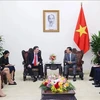 Deputy Prime Minister Tran Hong Ha (R) receives US Ambassador to Vietnam Marc Knapper. (Photo: VNA)