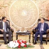 Secretary of the Party Central Committee and head of its Commission for External Relations Le Hoai Trung (R) and Chinese Ambassador to Vietnam He Wei (Photo: VNA)