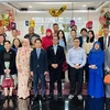 Participants at the workshop pose for group photo (Photo: VNA)