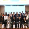 Participants at the international forum on socialism pose for a group photo (Photo: VNA)