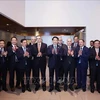 State President Luong Cuong (fifth from right) posing for a photo with leaders of major Peruvian businesses, and Vietnamese officials (Photo: VNA)