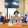 Minister-President of the Central Bank of Cuba Juanna Lilia Delgado Portal (central) at the working session with the Vietnam Bank for Social Policies. (Photo: VNA)