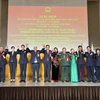 Participants pose for a group photo at a ceremony to celebrate the 80th anniversary of the Vietnam People's Army in the East Asian nation (Photo: VNA)