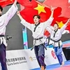 Vietnamese athletes celebrate their victory in the over-17 freestyle mixed team at the World Taekwondo Poomsae (performance) Championships 2024 on November 30 in Hong Kong. (Photo of Vietnam Sports Team)