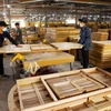 Workers at a furniture manufacturing company in Binh Dinh Province. The UK – Vietnam Free Trade Agreement is one the key drivers of growth in timber and wood product exports to the UK. (Photo: VNA)