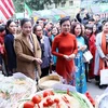 Delegates visit a booth at the event (Photo: VNA)