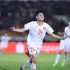 Nguyen Hai Long (24) celebrates his opener against Laos. (Photo: VNA)