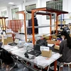 Workers from a cosmetics store based in Thu Duc city pack products for online shoppers. (Photo: VNA)