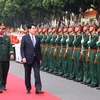 State President Luong Cuong reviews the guard of honour (Photo: VNA)