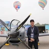 Nguyen Hoai Nam, one of the three founding members behind the idea of TP-150, takes a photo with the aircraft (Photo: sggp.org.vn) 