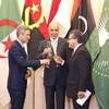 Assistant to the Minister of Foreign Affairs Nguyen Minh Vu (left), Moroccan Ambassador Jamale Chouaibi (centre) and Palestianian Ambassador Saadi Salama, who is also head of the diplomatic corps in Vietnam, toast at the ceremony on May 24. (Photo: VNA)