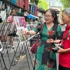 Visitors to the Truong Sa-themed photo exhibition on the Nguyen Van Binh book street in HCM City. (Photo: VNA)