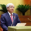 El presidente del Comité Central del Frente de la Patria de Vietnam, Do Van Chien, presenta su informe. (Foto: VNA)