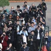 Reporteros participan en la ceremonia de bienvenida al secretario general del Partido Comunista de China y presidente ese país, Xi Jinping, en Hanoi en diciembre de 2023 (Foto: VNA)