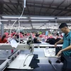 Muchas empresas de confecciones textiles han recibido pedidos hasta el cuarto trimestre. (Foto: VietnamPlus)