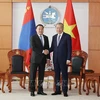 El secretario general del Partido Comunista y presidente de Vietnam, To Lam (derecha), se reúne con el presidente del Gran Jural del Estado (Parlamento) de Mongolia, Dashzegve Amarbayasgalan. (Foto: VNA)