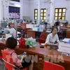 Transactions à une succursale de la Banque Agribank à Lao Cai. Photo : VNA 