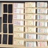 Argent liquide et accessoires de jeu saisis lors d'une opération transnationale de piratage de paris illégaux par la police singapourienne et malaisienne. (Photo : canalnewsasia.com)