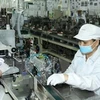 Fabrication de composants électroniques chez Nidec Sankyo Ltd Co., Ltd, basée au Japon, dans le parc de haute technologie de Saigon à Hô Chi Minh-Ville. (Photo : VNA)