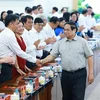 Le Premier ministre Pham Minh Chinh rencontre la permanence du Comité provincial du Parti de Binh Duong. Photo : VNA