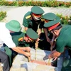 河静省为在老挝牺牲的志愿军和专家烈士举行追悼会和安葬仪式。图自越通社