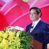 越南政府总理范明政发表讲话。图自越通社