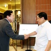 越南计划与投资部部长阮志勇和韩国中小企业联合会主席Kim Ki Moon。图自越通社